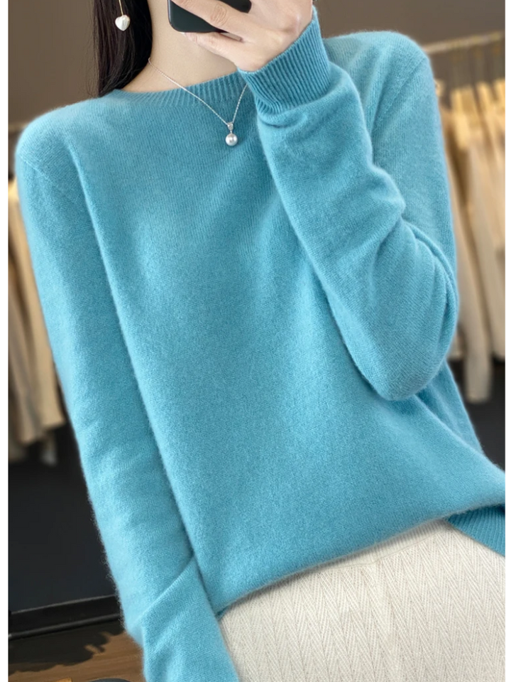 Long sleeve women's soft pullover, round neck design for an elegant, casual look.