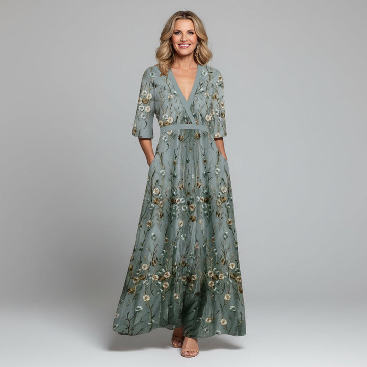Sage green floral embroidered maxi dress for women, an elegant bohemian summer holiday or wedding guest gown.