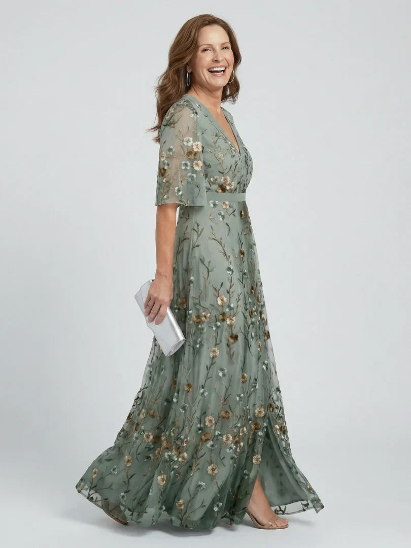 Close-up of intricate floral embroidery on a sage green women's maxi dress, ideal for parties & holidays.
