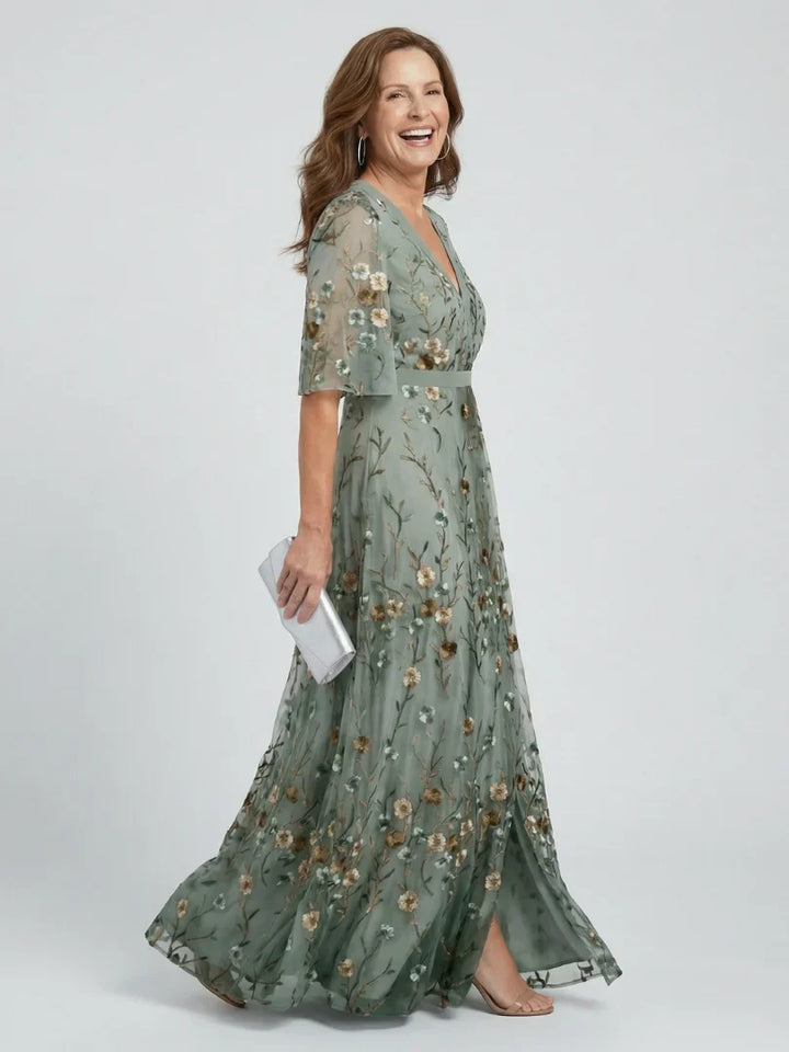 Close-up of intricate floral embroidery on a sage green women's maxi dress, ideal for parties & holidays.