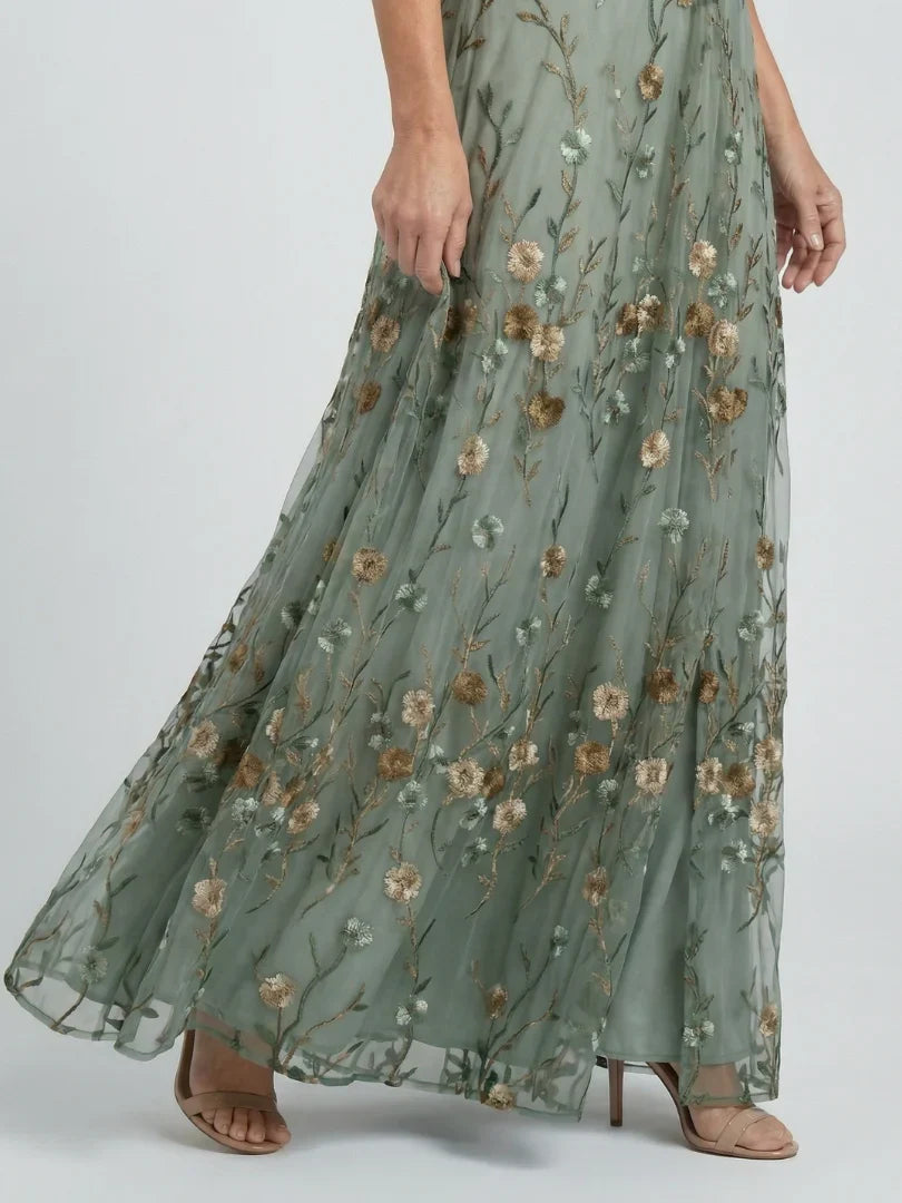 Flowing sage green maxi gown with delicate floral embroidery, perfect for women's summer holidays.
