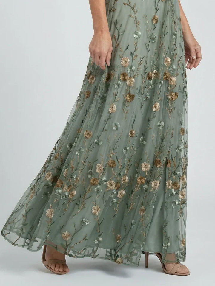 Flowing sage green maxi gown with delicate floral embroidery, perfect for women's summer holidays.