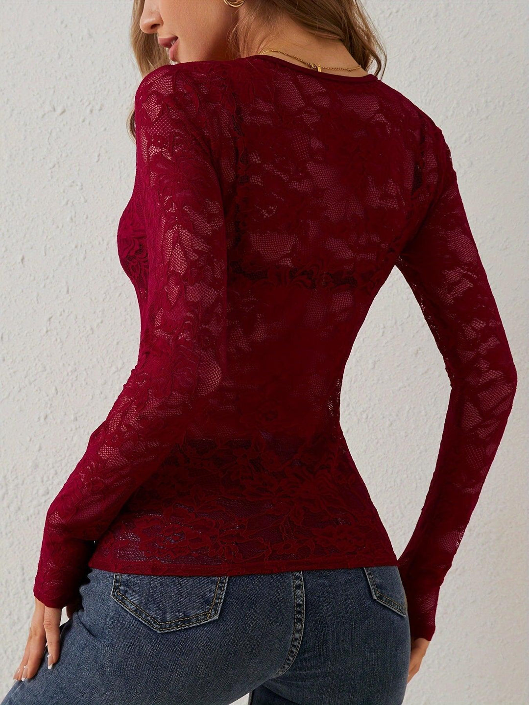 Fitted women's sheer lace V-neck long sleeve blouse, a stylish and elegant top for evenings.