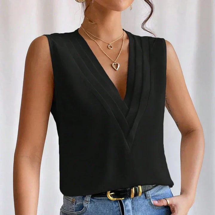 Versatile women's sleeveless top, great for elegant summer outfits & professional workwear.
