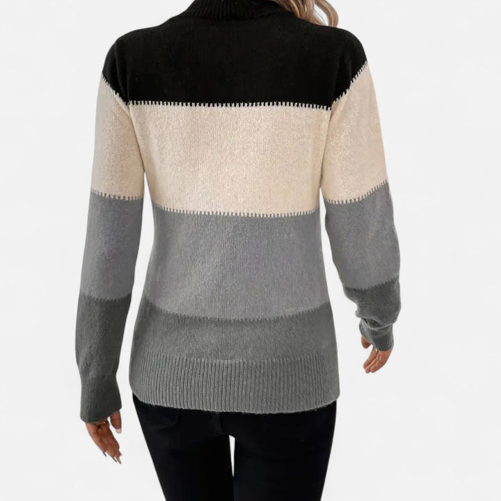 Soft, comfortable women's striped crew neck pullover sweater, designed for chic everyday wear.