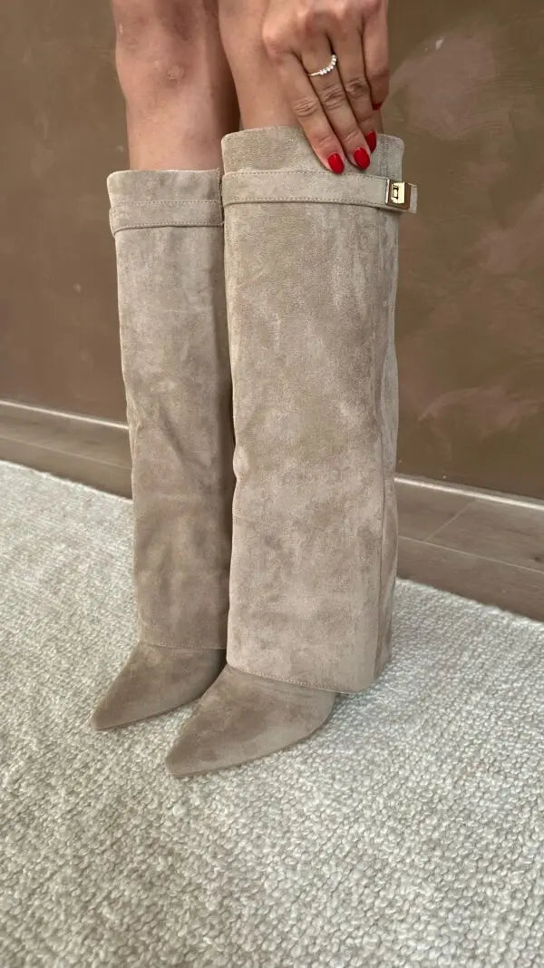 Elegant black dress boots for women, tall and sleek, perfect for sophisticated winter ensembles.