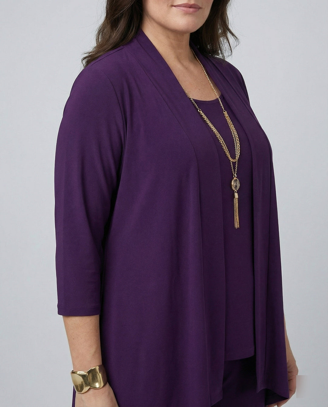 Professional women's tailored pantsuit featuring a stylish blazer, smart vest, and classic straight-leg trousers.
