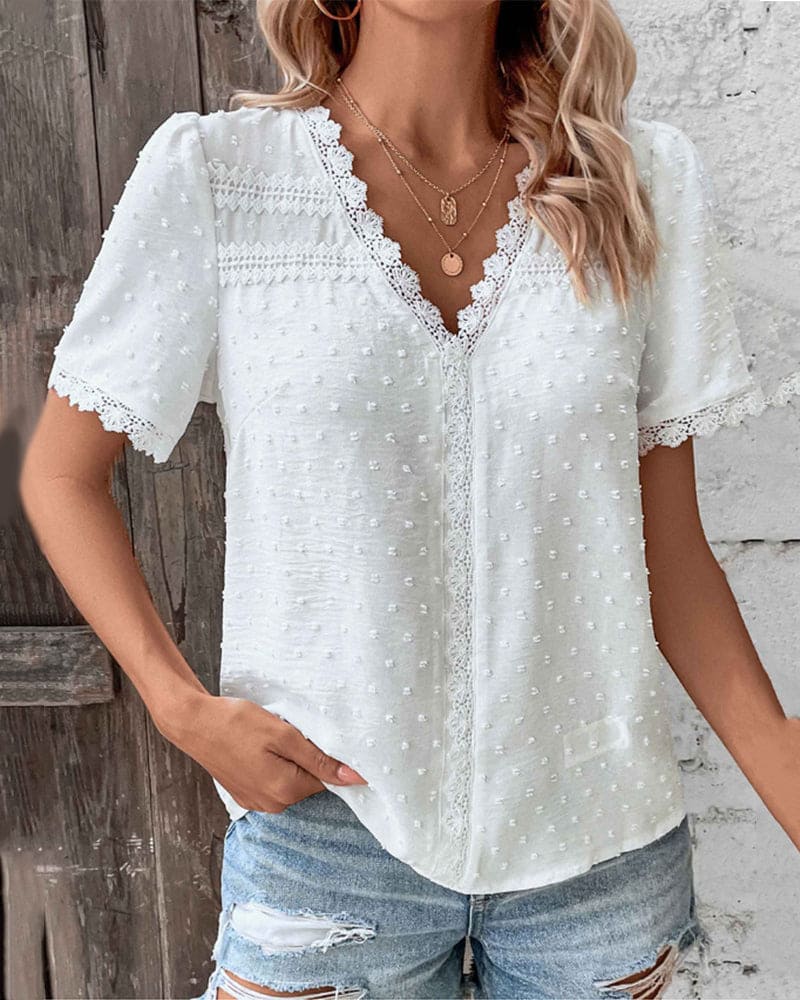 Delicate women's V-neck summer blouse for casual wear or holiday outfits, short sleeve, lightweight.