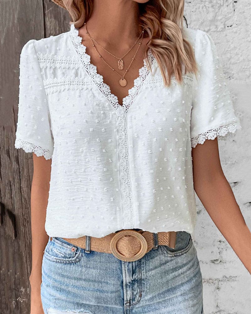 Textured V-neck women's summer blouse, short sleeve, relaxed fit. Elegant & lightweight for warm weather.