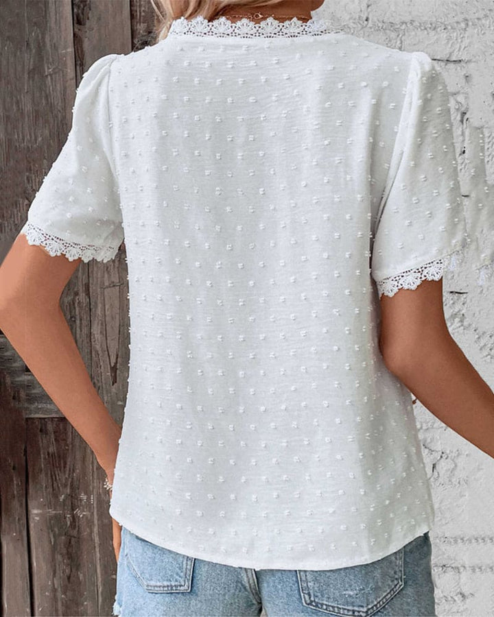 Relaxed fit women's V-neck summer blouse, lightweight textured fabric, short sleeve. Elegant & comfortable.