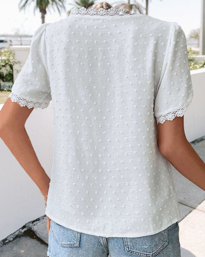 Versatile women's short sleeve V-neck blouse, lightweight textured summer top, elegant for casual outfits.