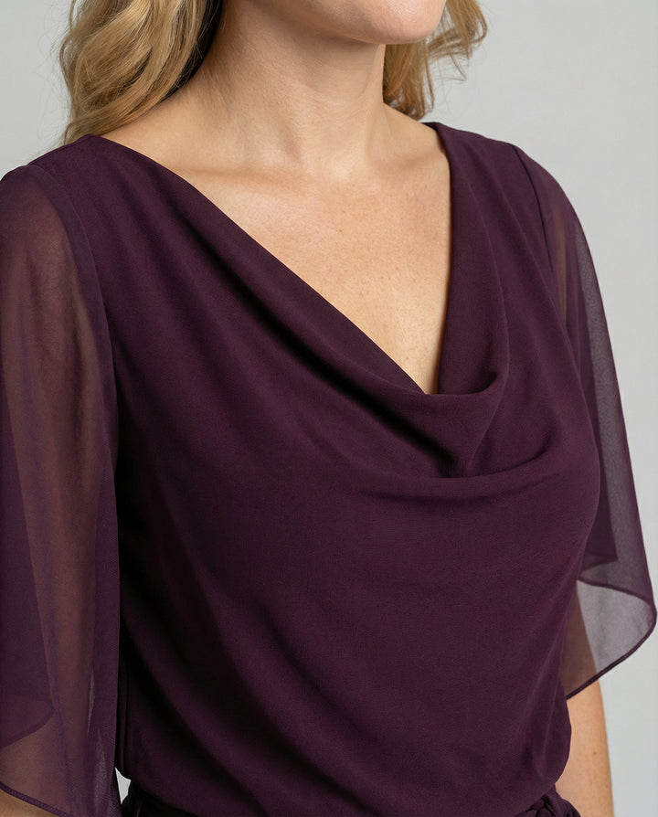 Sophisticated wide-leg jumpsuit for women, featuring a flowing silhouette, cascading neckline & lace-up detail.