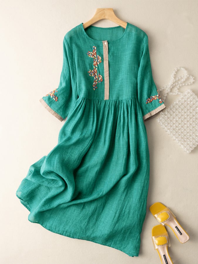 Boho-style women's midi dress with intricate embroidery, ideal for a relaxed summer day