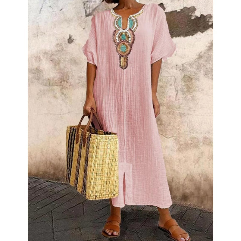 Embroidered women's summer dress in a flowing maxi length, suitable for casual outings