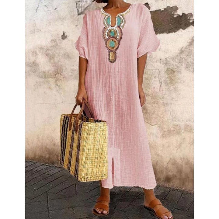 Embroidered women's summer dress in a flowing maxi length, suitable for casual outings