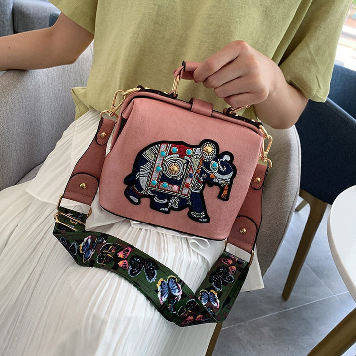 Side view of a lightweight embroidered mandala shoulder bag, soft PU coated cotton, fashion.