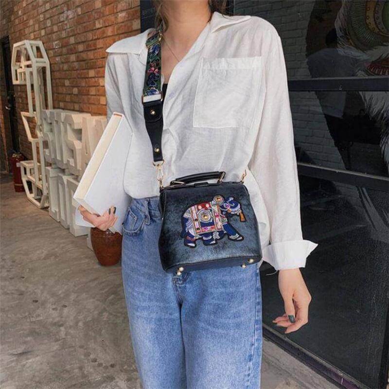 Woman carrying a lightweight embroidered mandala bohemian shoulder bag, ideal for daily carry.