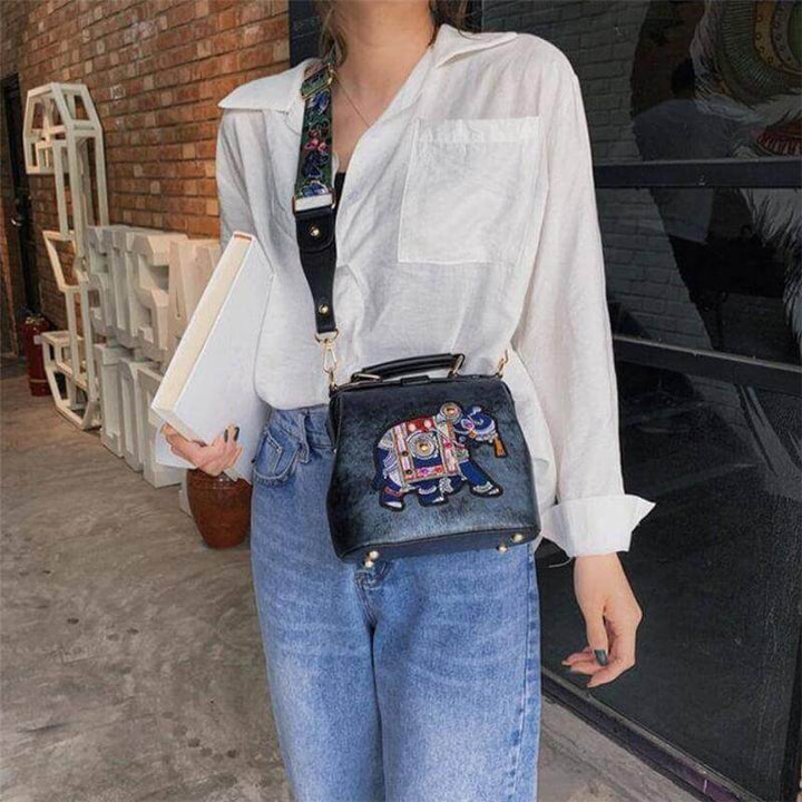 Woman carrying a lightweight embroidered mandala bohemian shoulder bag, ideal for daily carry.
