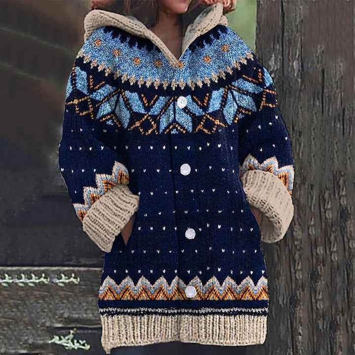 Close-up of Fair Isle pattern on women's hooded knit cardigan, rich multicolor details, soft texture