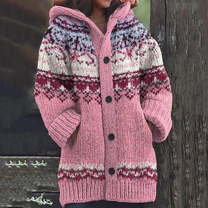 Detail of the hood and Fair Isle knit on a women's cozy multicolor cardigan, winter fashion