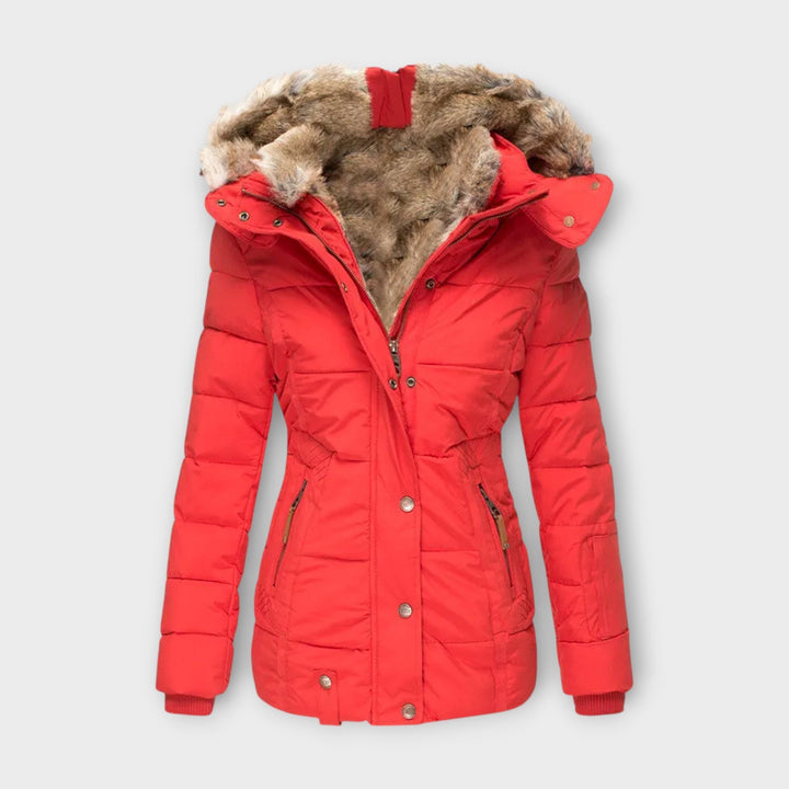 Women's parka jacket with adjustable waist and faux fur hood, providing a flattering winter look