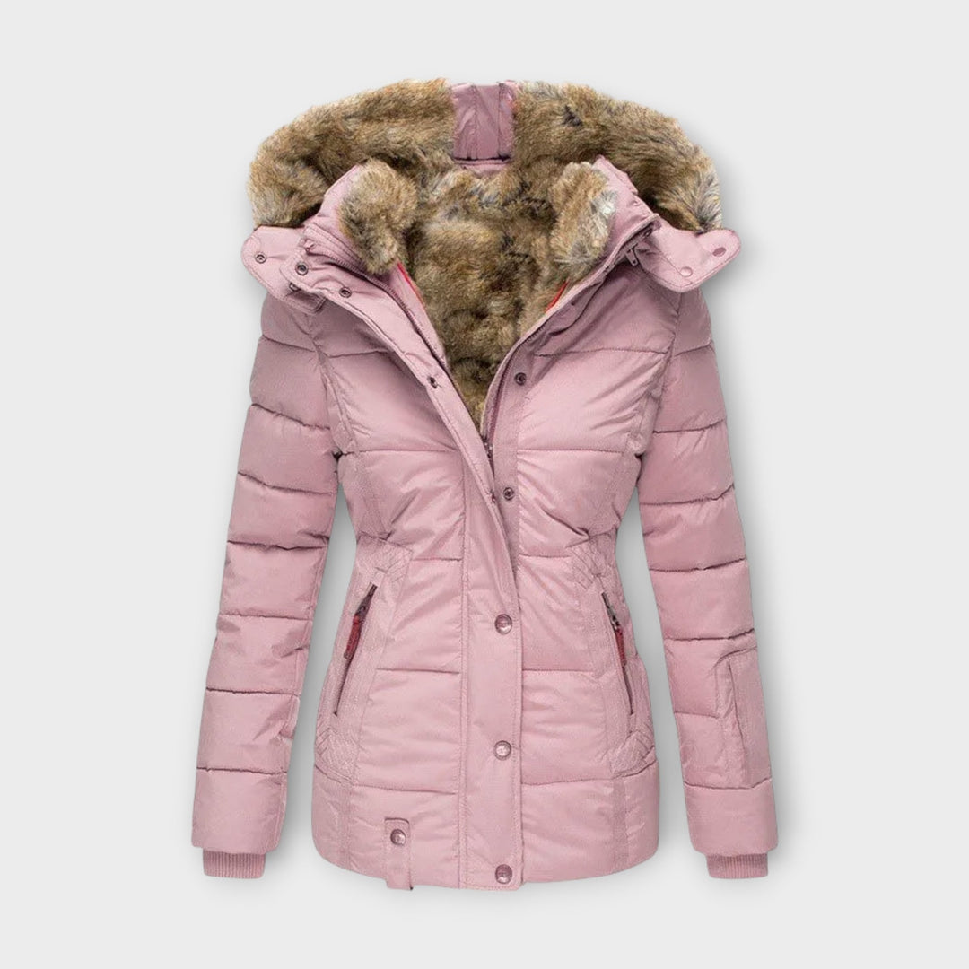 Detail of zipper and buttons on women's faux fur-lined winter parka jacket, durable outerwear