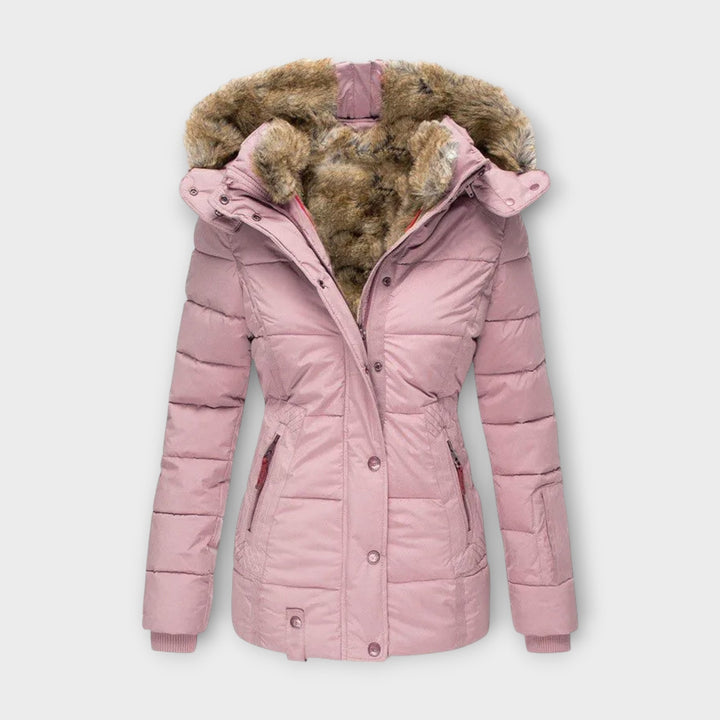 Detail of zipper and buttons on women's faux fur-lined winter parka jacket, durable outerwear