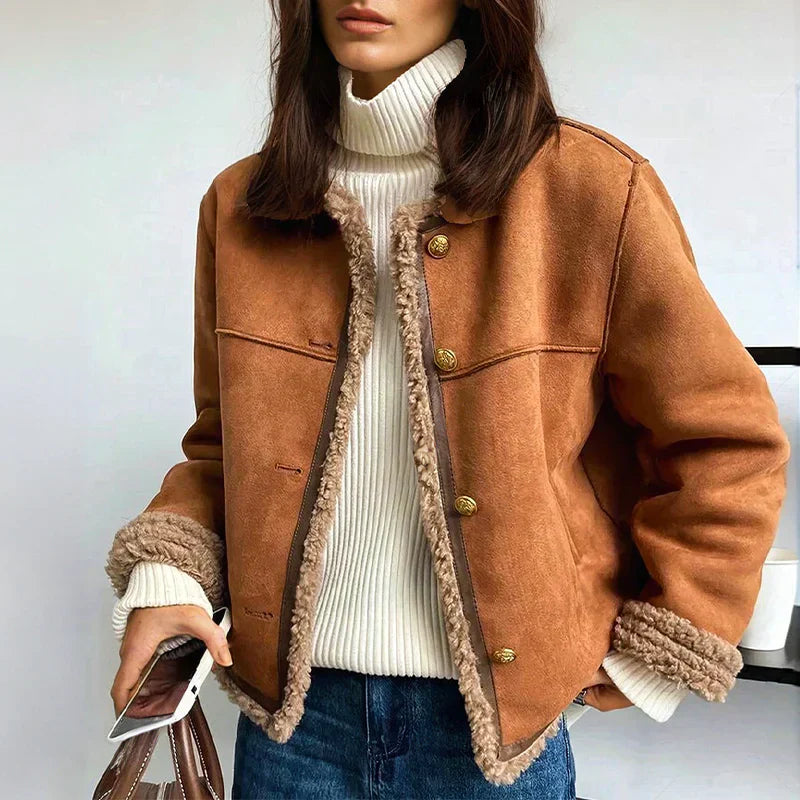 Close-up of buttons on women's faux shearling winter jacket, cozy texture