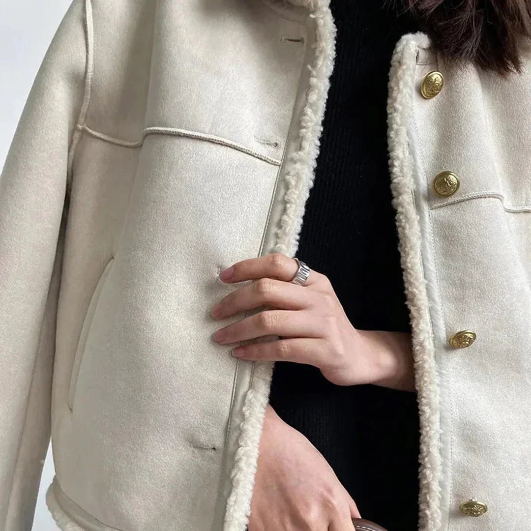 Back view of women's cream faux shearling jacket, winter outerwear trend