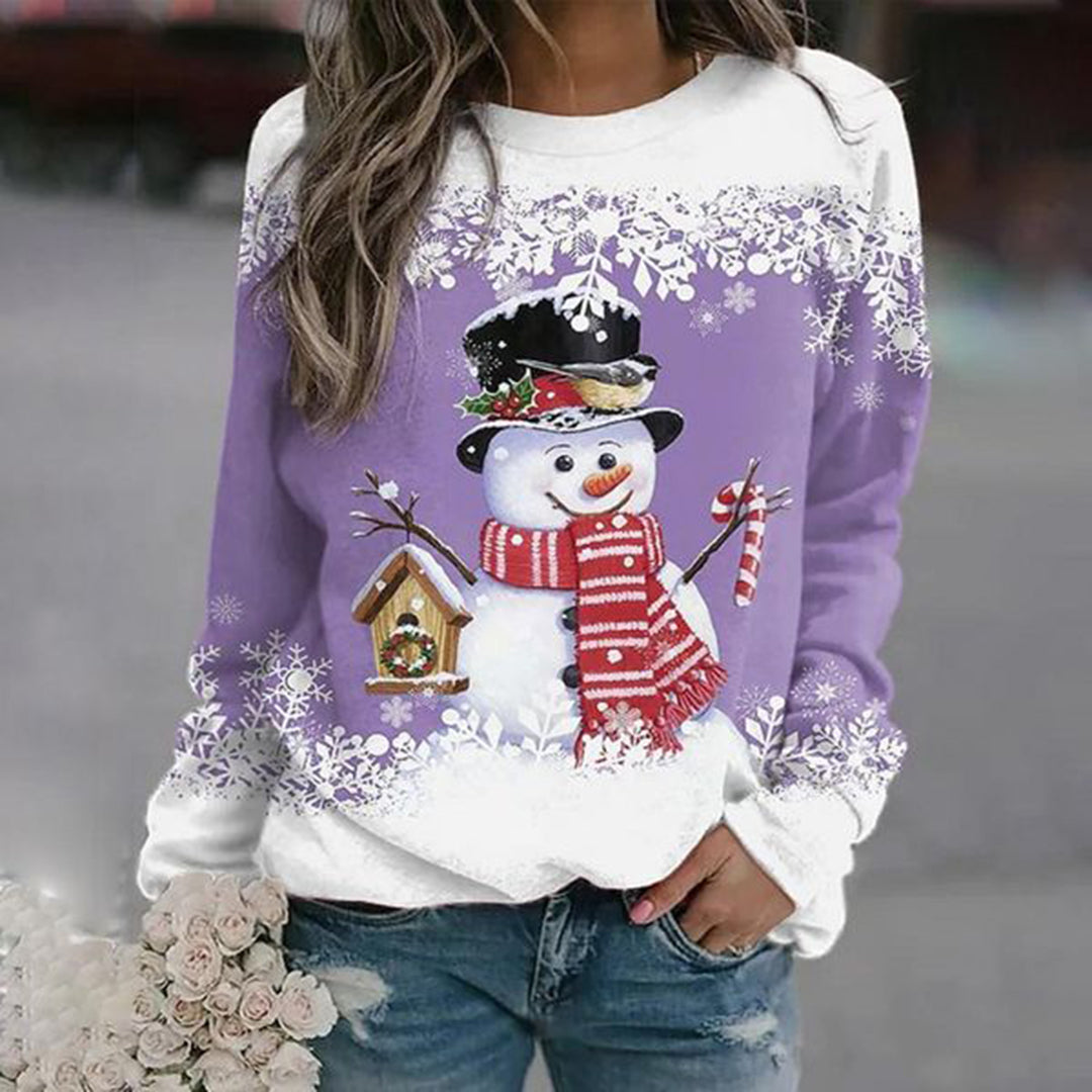 Women's winter wear: a cozy Christmas sweater pullover with a cheerful snowman graphic.