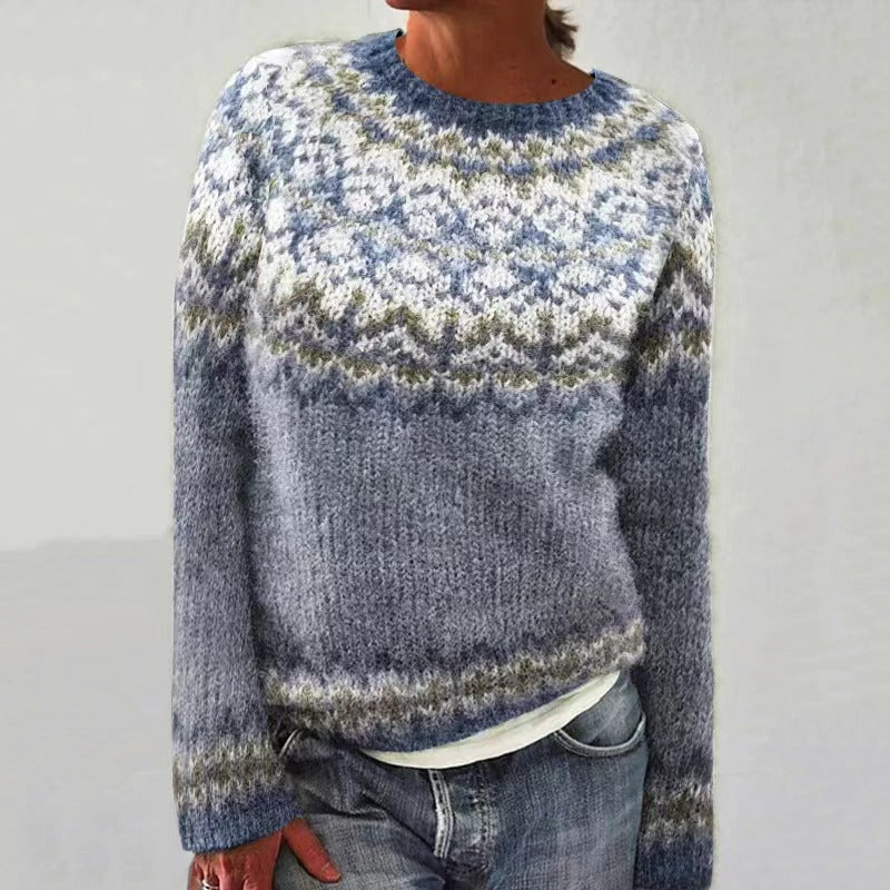 Festive red knit sweater for women, showcasing a beautiful reindeer pattern, essential holiday apparel.