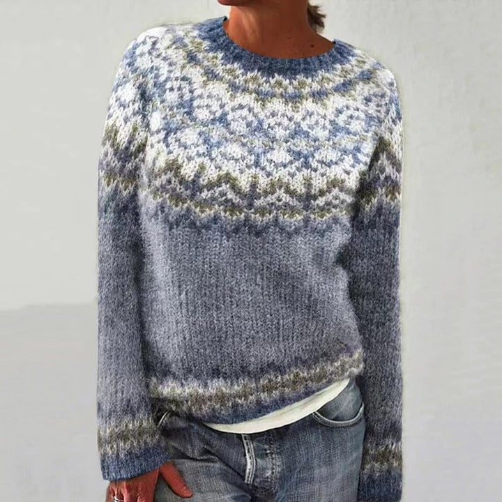 Festive red knit sweater for women, showcasing a beautiful reindeer pattern, essential holiday apparel.