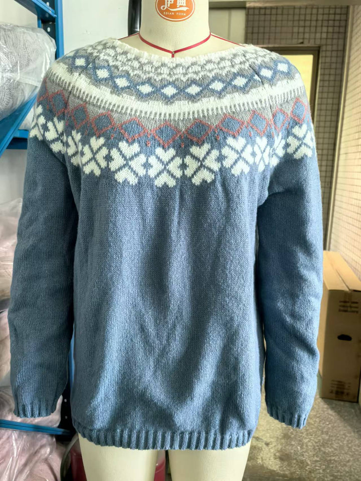 Red women's Christmas sweater with a prominent reindeer knit, an ideal choice for festive gatherings.