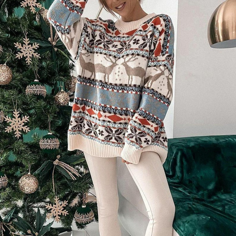 Women's festive red reindeer pattern Christmas sweater with white snowflakes and crew neck