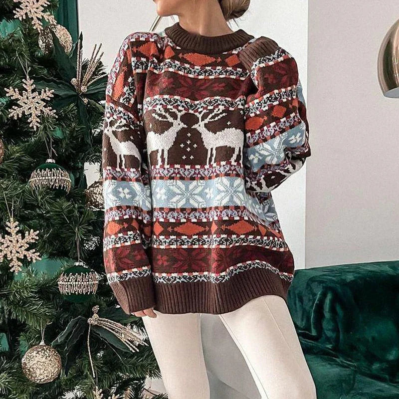 Close-up of a women's cozy knitted Christmas sweater featuring a charming reindeer motif