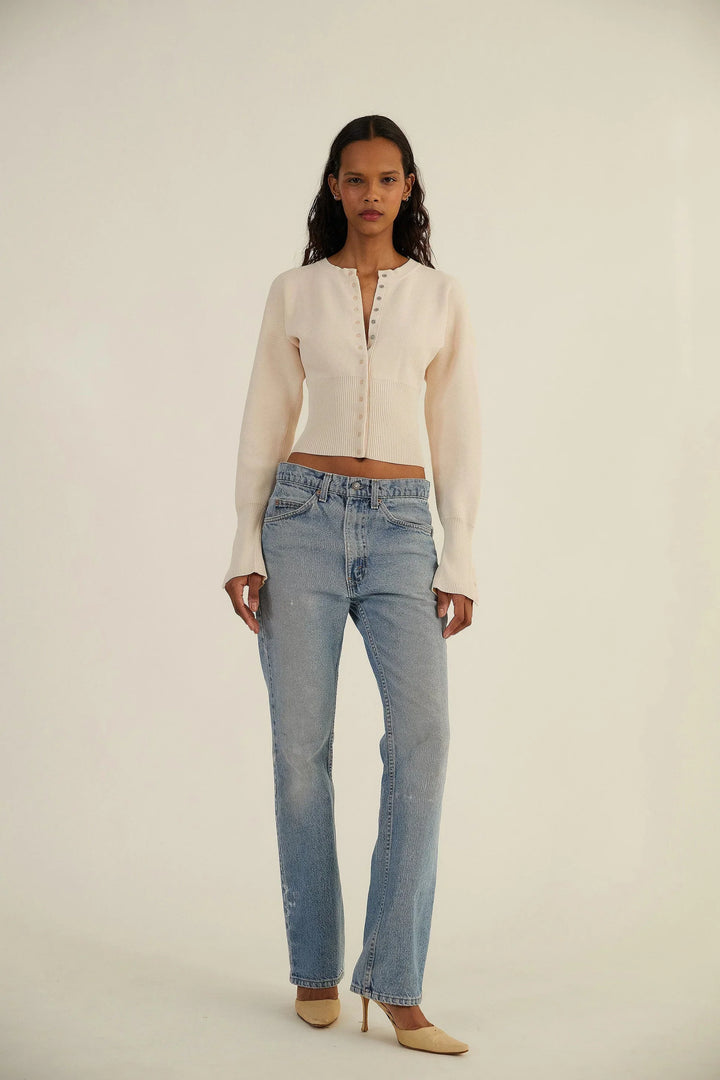 Chic long sleeve fitted cardigan for women, featuring a trendy cropped cut and button-up front.