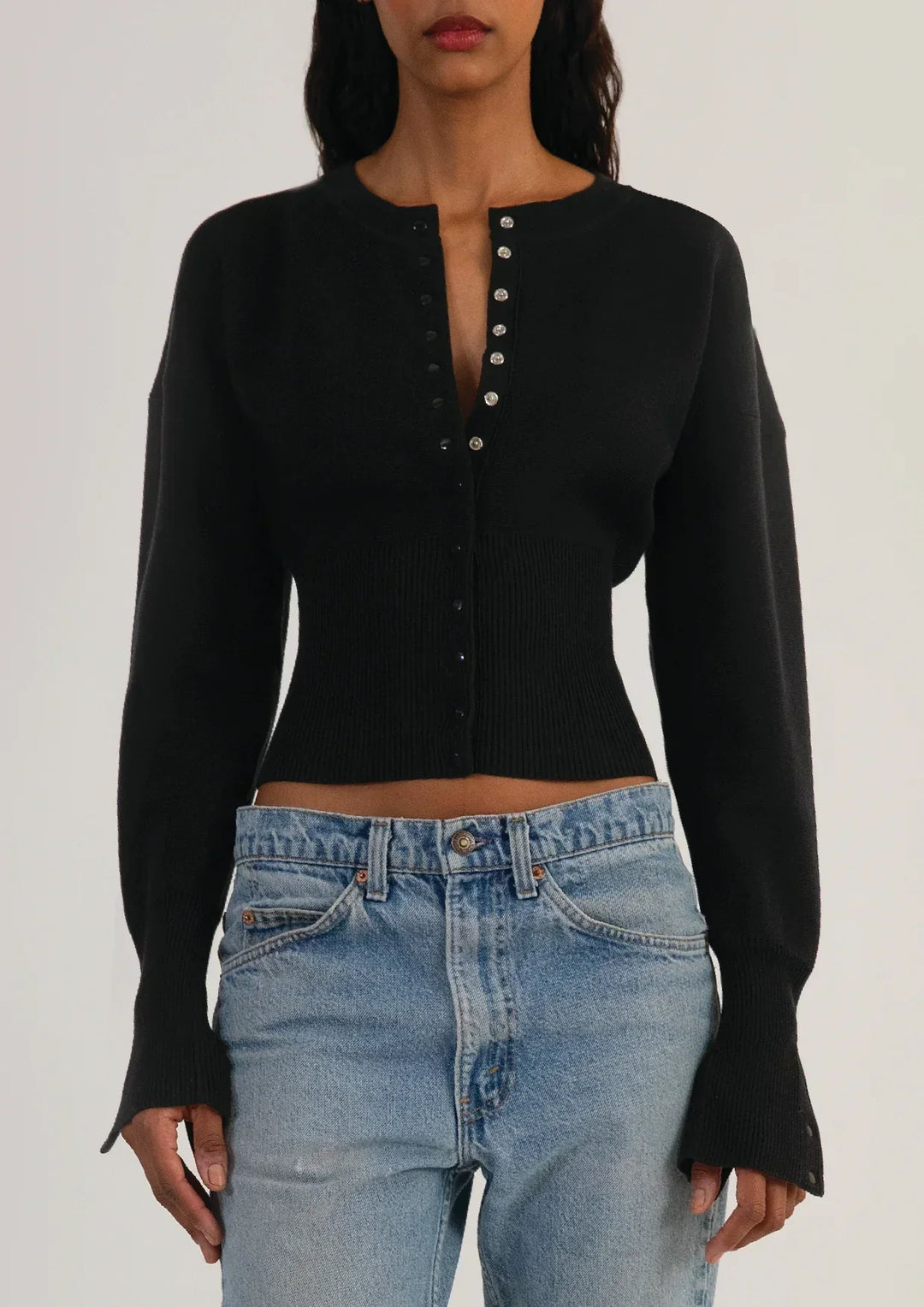 Elegant women's button-up cardigan, a fitted long sleeve cropped knit top. Chic and versatile.