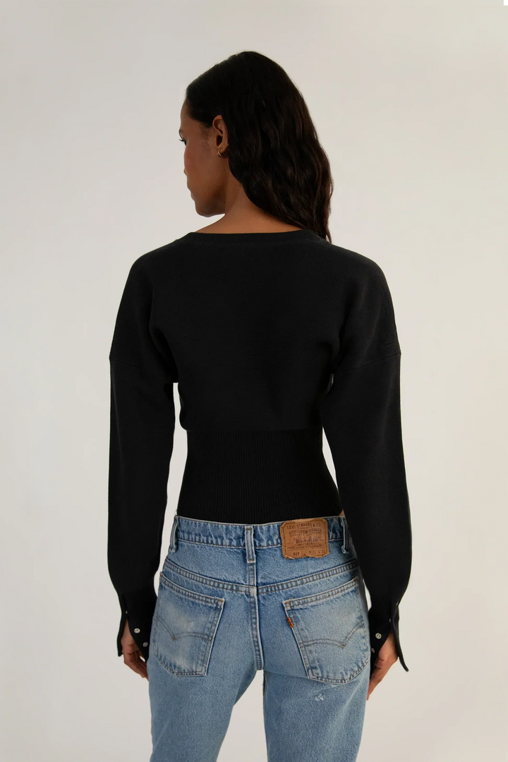Modern women's fitted long sleeve cropped cardigan with stylish button-up front. Versatile layering top.
