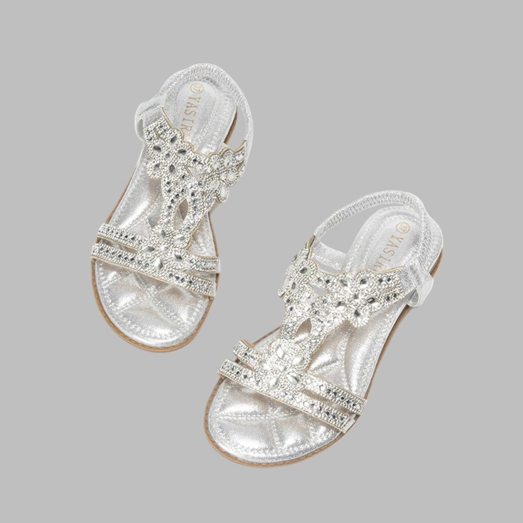 Pair of women's flat floral sandals, a versatile and trendy choice for spring and summer