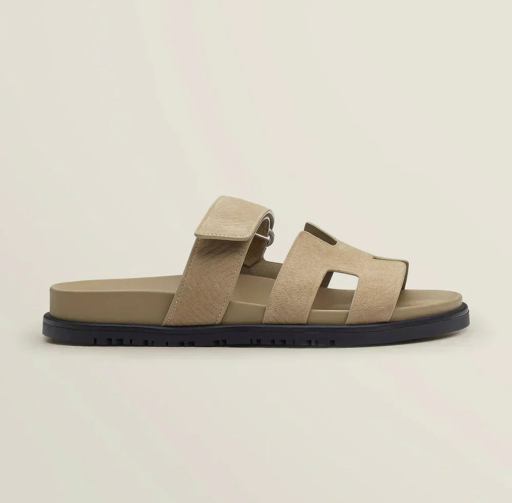 High angle shot of women's minimalist adjustable strap flat sandals, essential summer footwear.