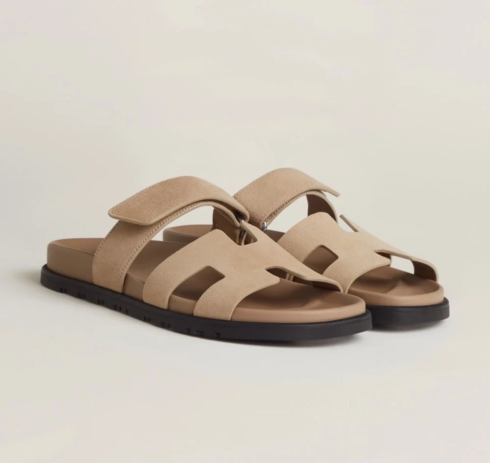 Front view of purple women's flat sandals with adjustable straps, chic summer footwear.