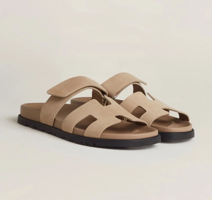 Front view of purple women's flat sandals with adjustable straps, chic summer footwear.
