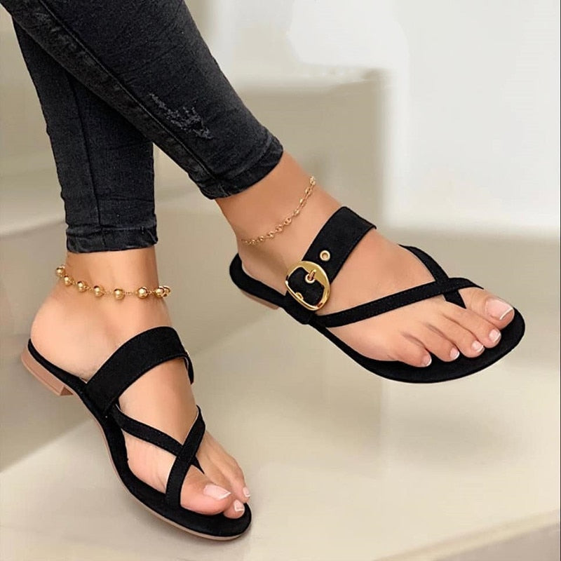 Women's flat strap sandals with stylish buckle detail. Lightweight & comfortable, perfect for casual summer wear.