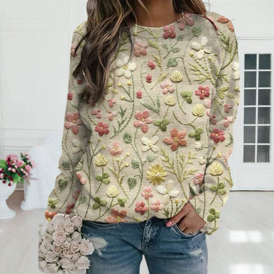 Women's floral embroidered crew neck sweater. Lightweight, long sleeve spring knit top for versatile casual wear.