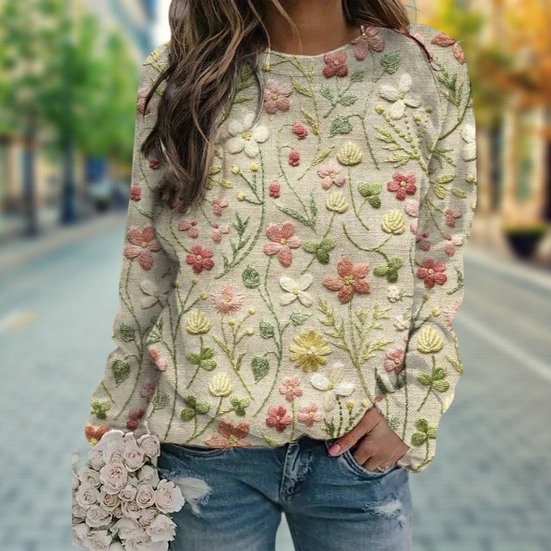 Elegant women's floral embroidered crew neck knit sweater. Soft, lightweight spring top perfect for comfortable daily fashion.