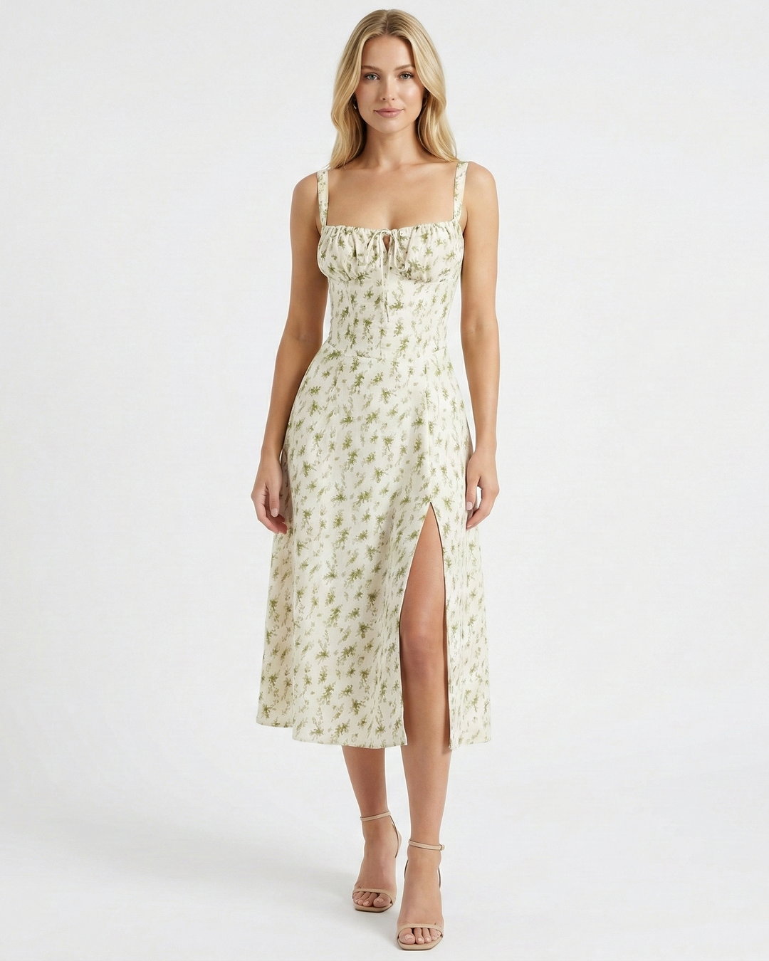 Feminine floral midi dress featuring a square neck, ruched bust, and a stylish flowy leg slit. Summer casual wear.