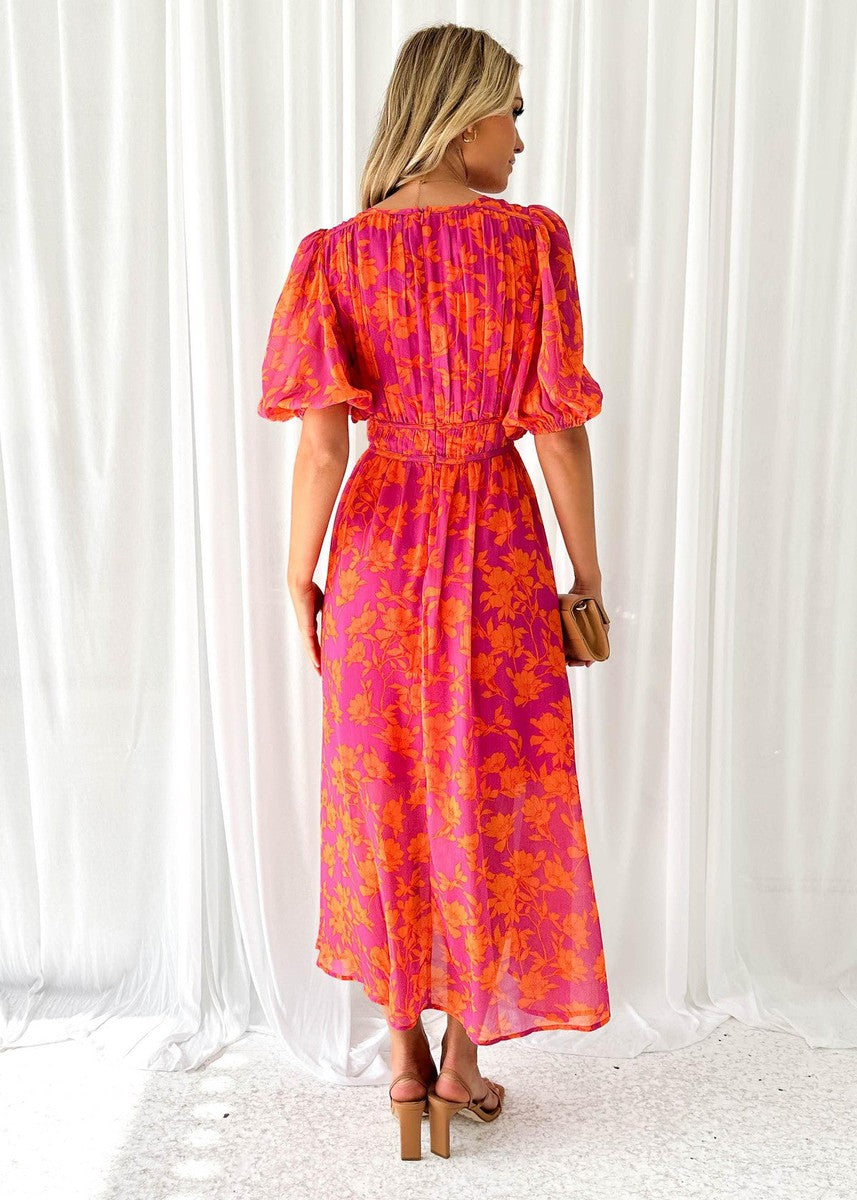 Model wearing a women's floral midi summer dress, puff sleeve, elegant pink & orange design