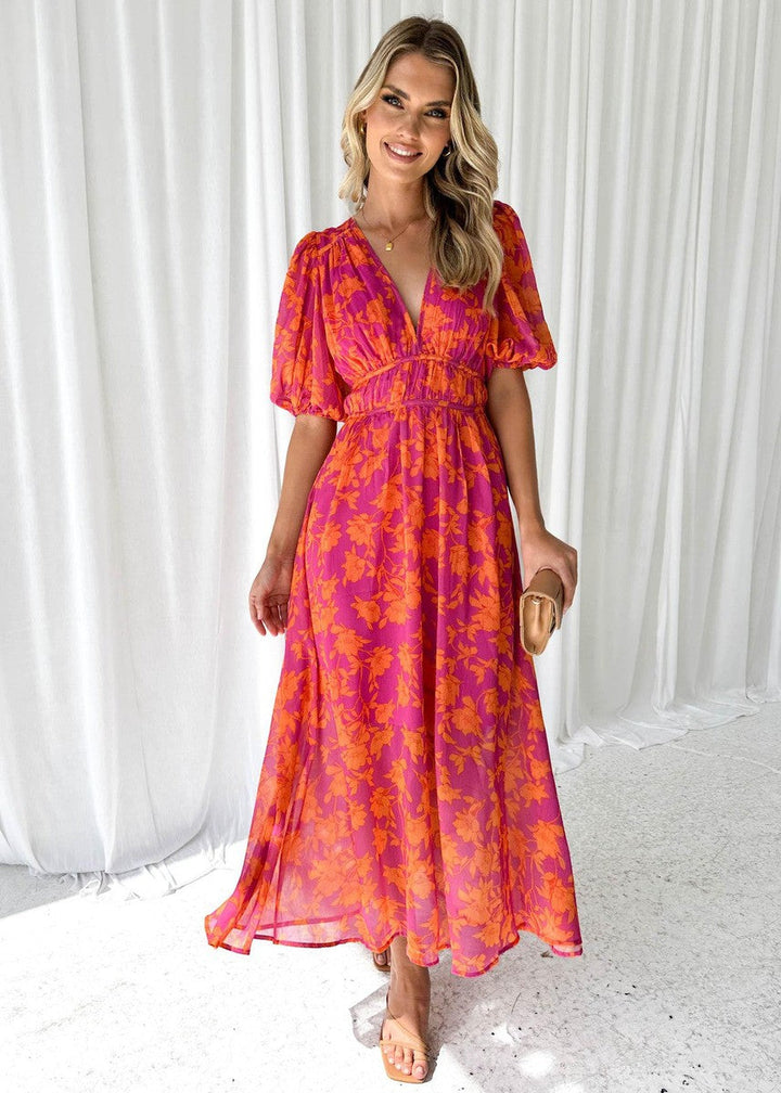 Back view of a women's floral midi summer dress, ideal for casual and occasion wear