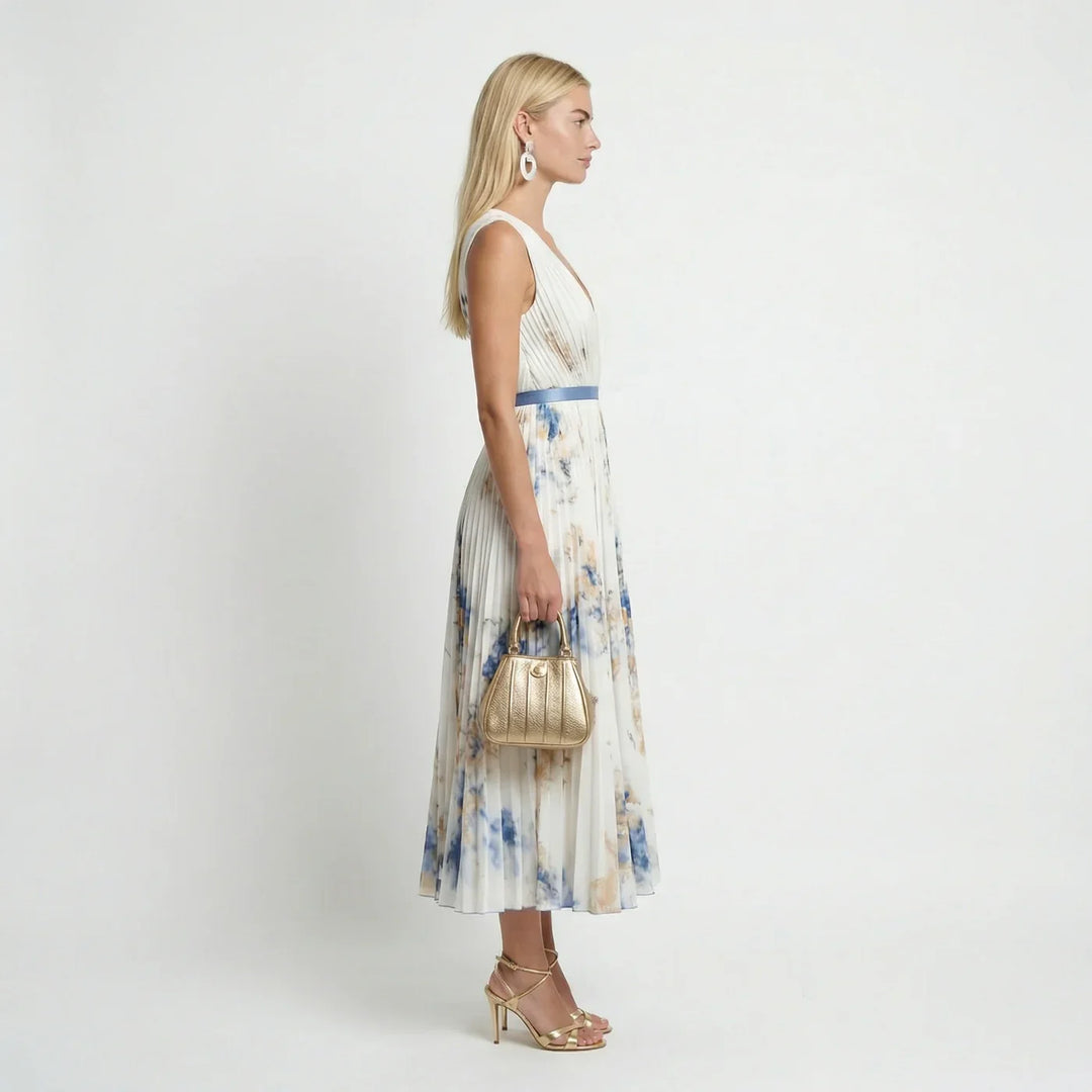 Flowy white women's floral pleated maxi dress with sleeveless V-neck, a chic choice for summer elegance.