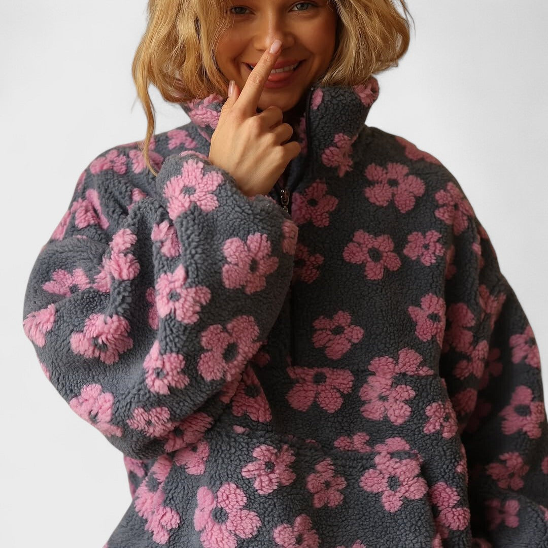 Women's cozy fleece pullover with an elegant floral pattern, side view